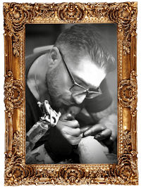 a man with glasses is getting tattooed in a gold frame